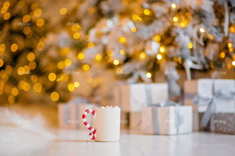 cup of coffee in a cozy festive Christmas atmosphere