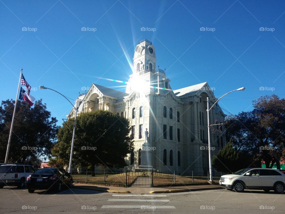 Hill County Courthouse Reflecting the Sun. Historic Hill County Courthouse in Hillsboro, Texas, burned to the ground in the 90s and rebuilt and restored by the devoted community