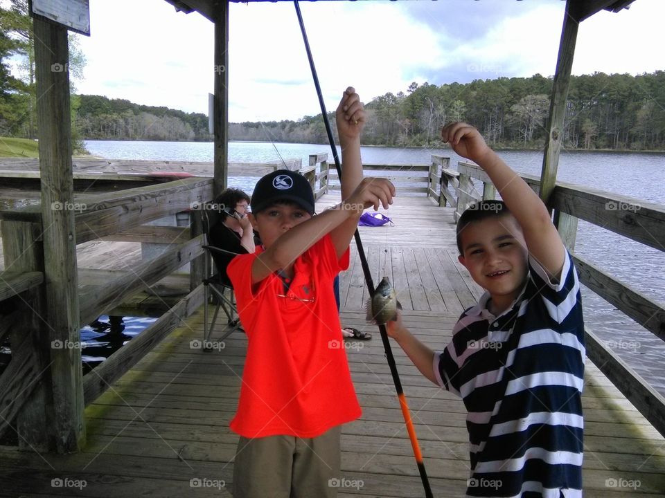 kids catching fish
