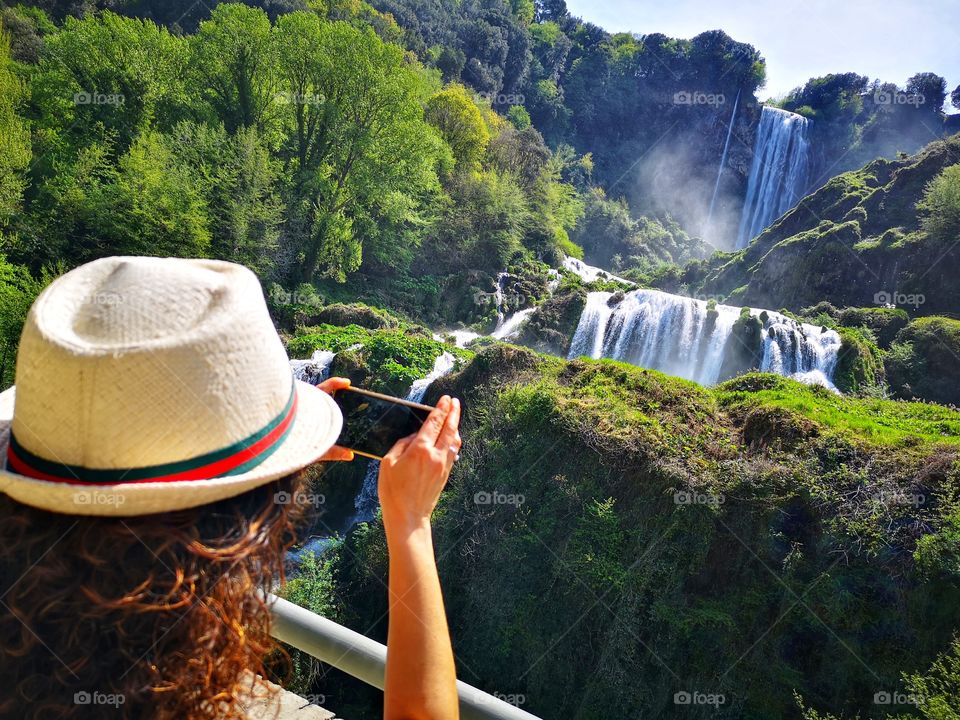 I from behind photographer the wonderful Marmore waterfalls (italy)