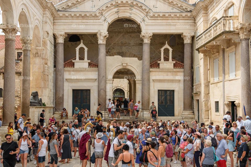 Crowds of tourists sightseeing city of Split and the peristyle of Diocletian's palace