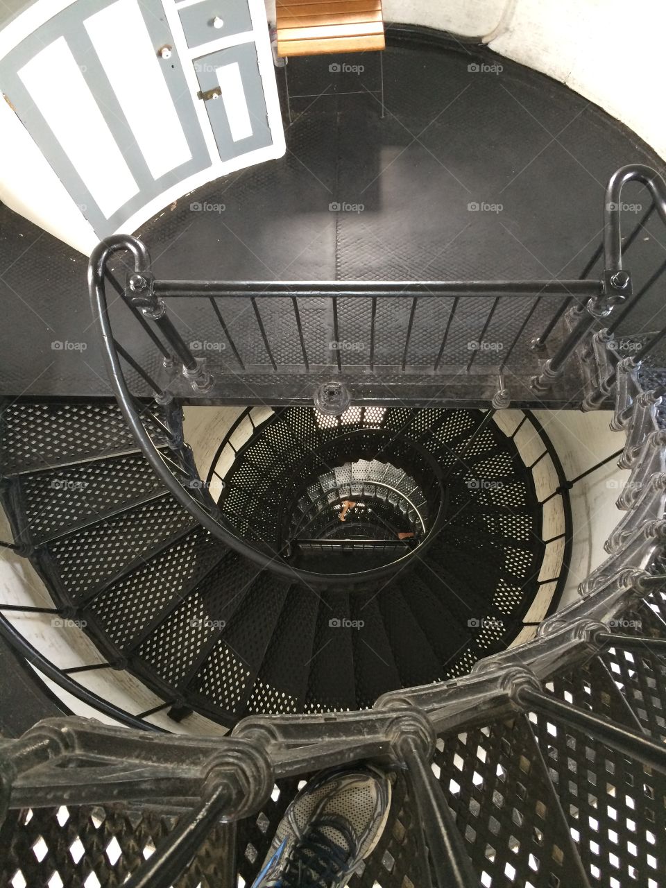 Steep winding staircase inside the St.  Augustine Lighthouse in Florida. 
