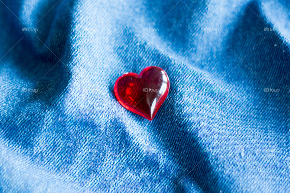 Love , red heart on blue jeans fabric, rött hjärta på blått jeanstyg , kärlek 