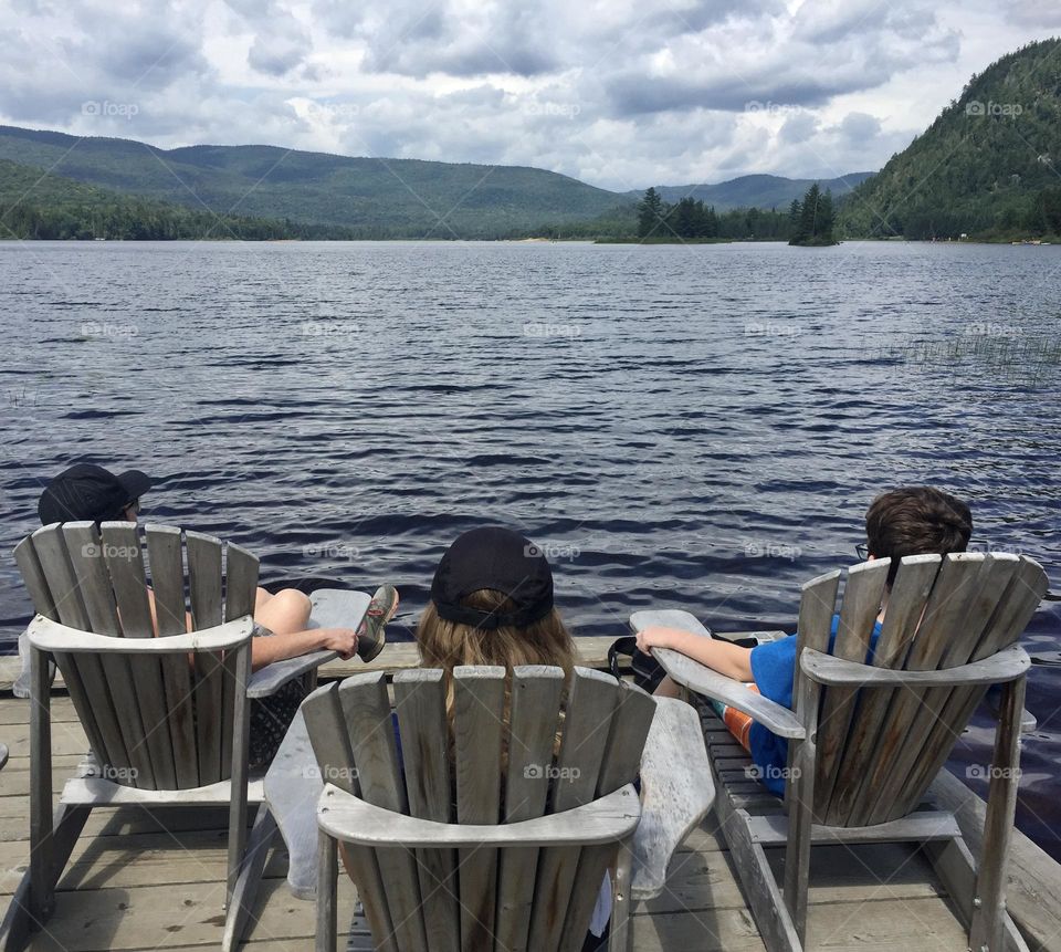 Relaxing after a hike in Mont Tremblant National Park in Muskoka chairs, admiring Monroe Lake.