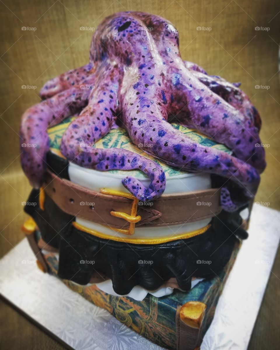 chocolate cake, decorated with fondant leather and lace, topped with lifelike octopus