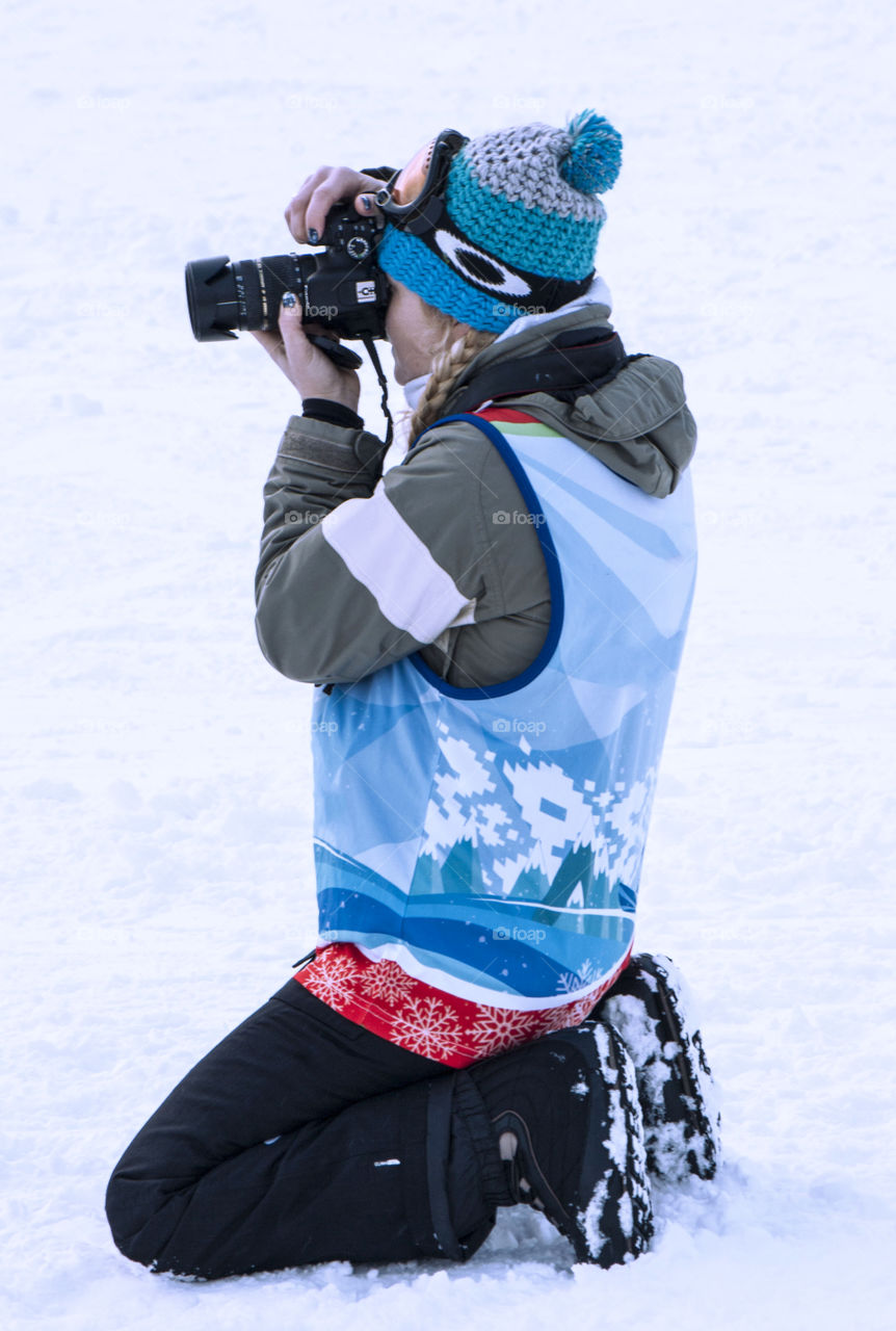Woman photographing in winter