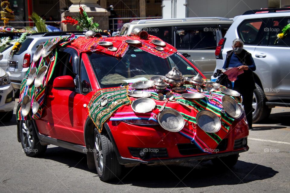 Car covered with kitchen utensils