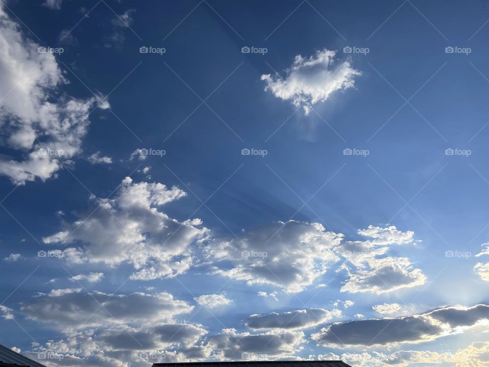 A partly cloudy sky photo. 
