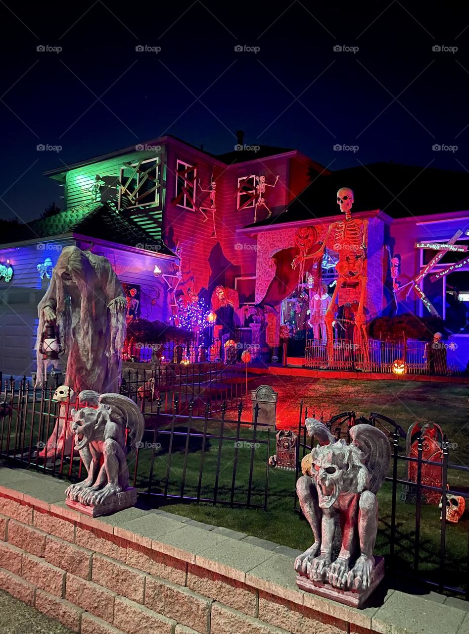 Scary Halloween outdoor decorations with monsters, skeletons and graves 