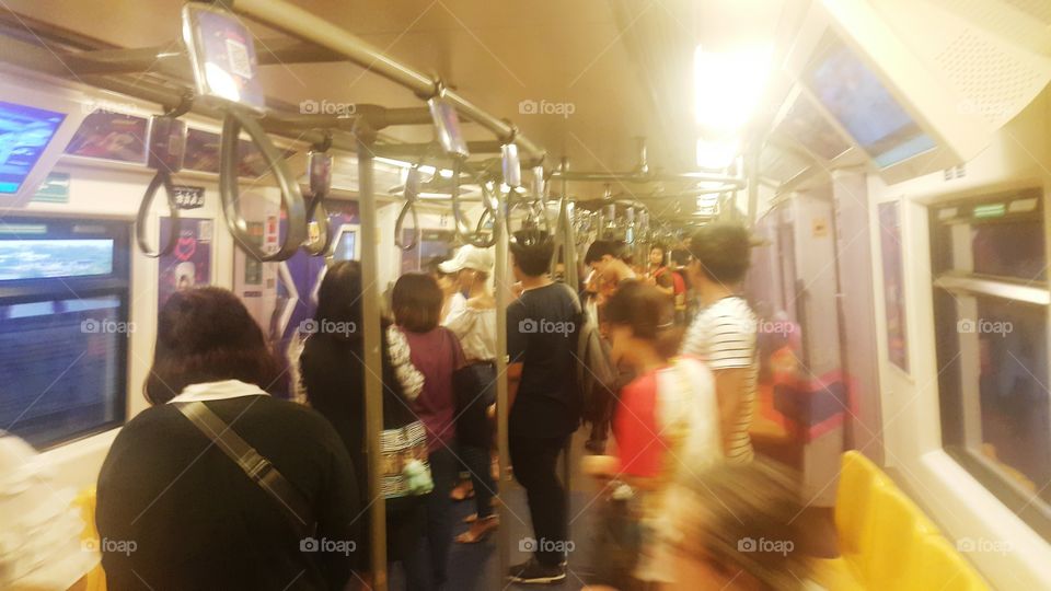 Blurred defocused abstract background of people on bts train ,Bangkok,Thailand