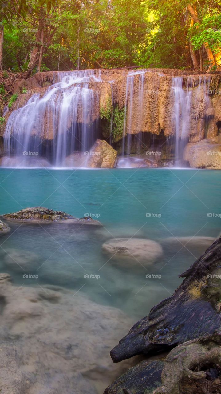All the elements of nature work they  go so well together to produce this breath-taking view of soft waterfalls flowing peacefully in the deep turquise calm water below and the other elements create a rock pool of serenity, picture perfect paradise