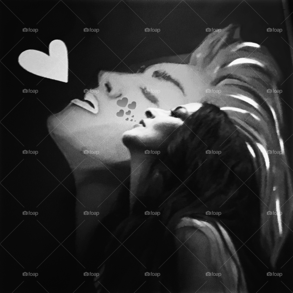 Side view of woman in front of graffiti