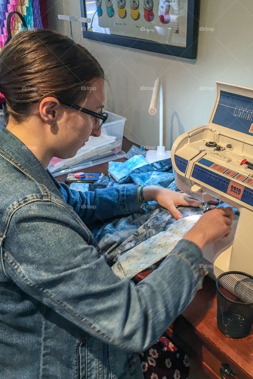 Finishing up a project where she made a kimono.  She was concentrating on getting them last steps done correctly. 