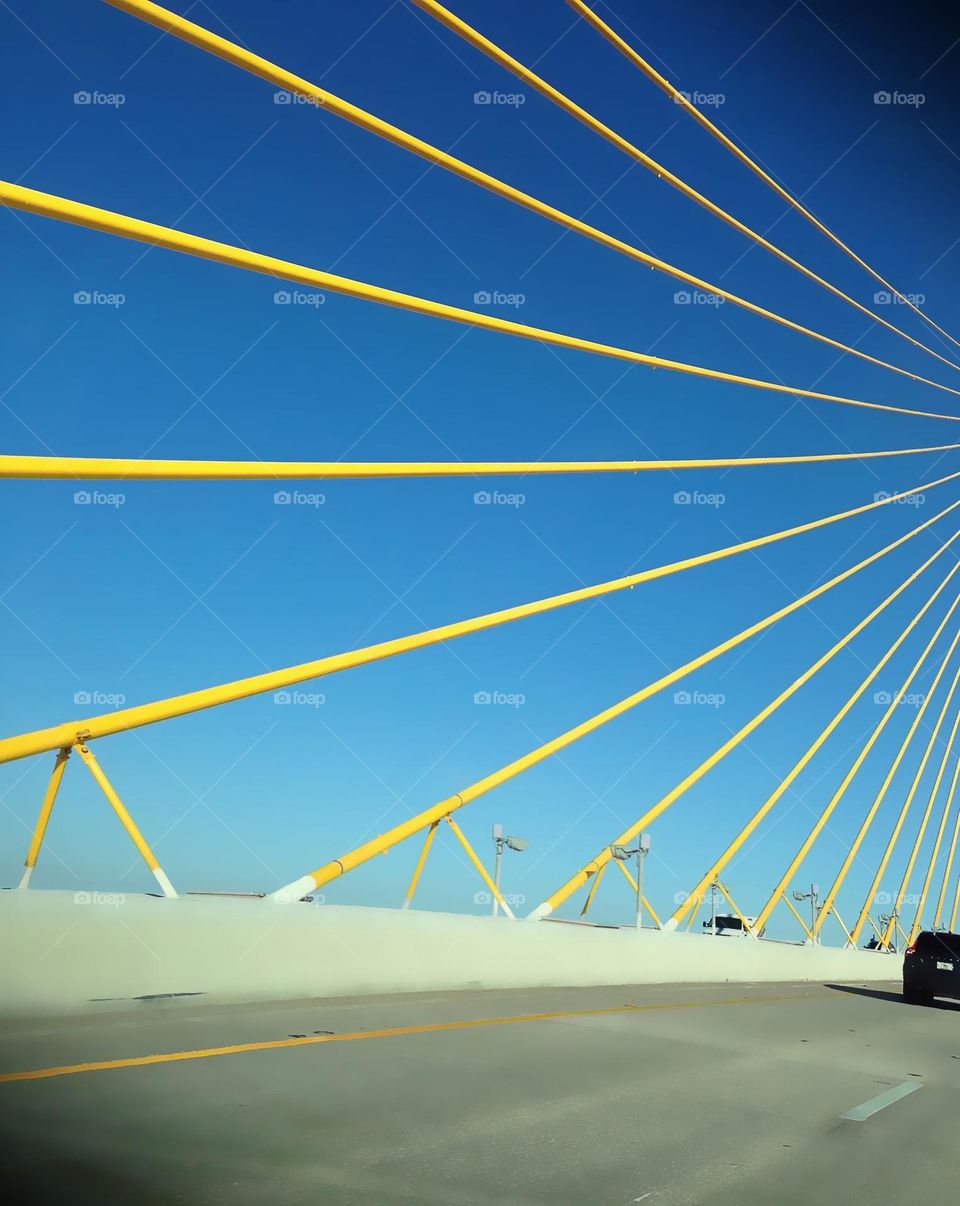 Distinctive row of yellow poles supporting the infamous SunShine Skyway Bridge.