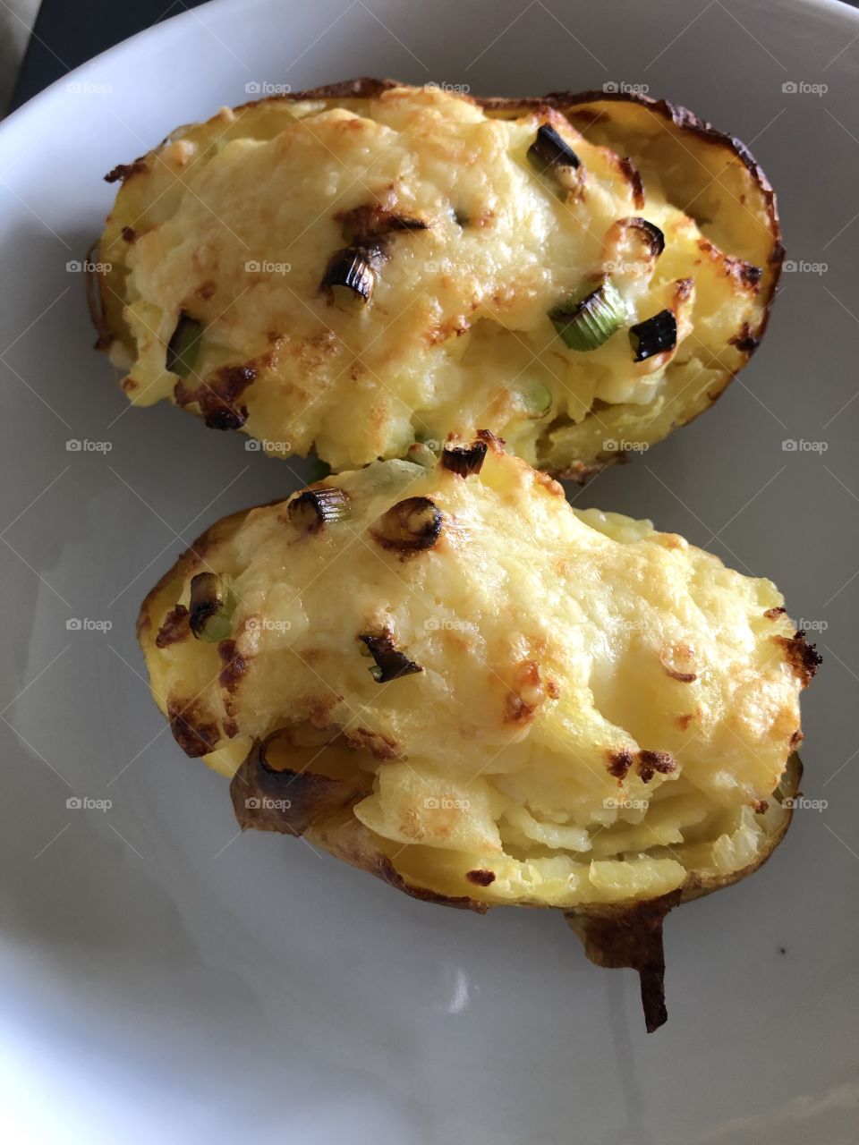 Cheese and spring onion baked potatoes 