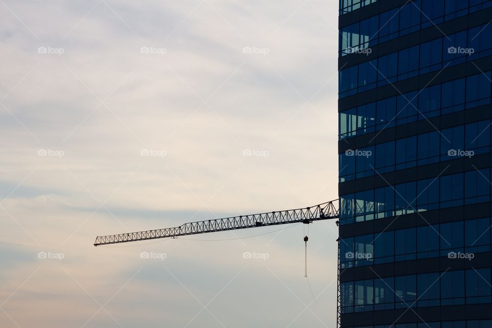 Construction crane and tall building at sunset in charlotte North Carolina 