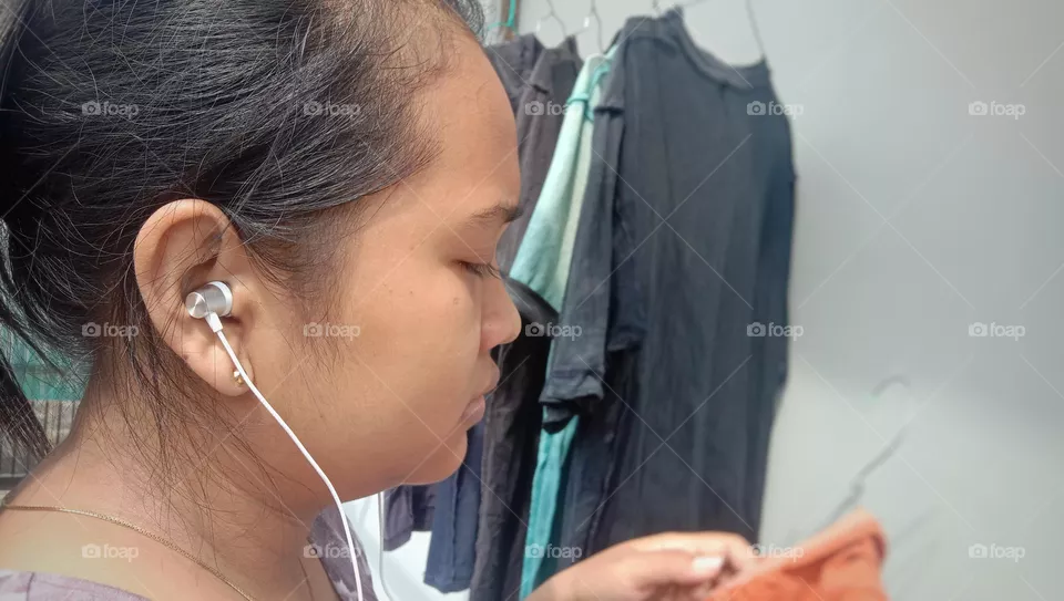 Woman listening to music with earphones