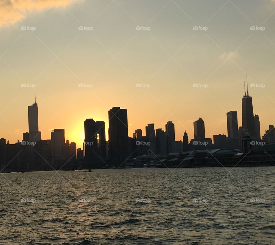 summer time sunset in chicago from a boat on the great lakes