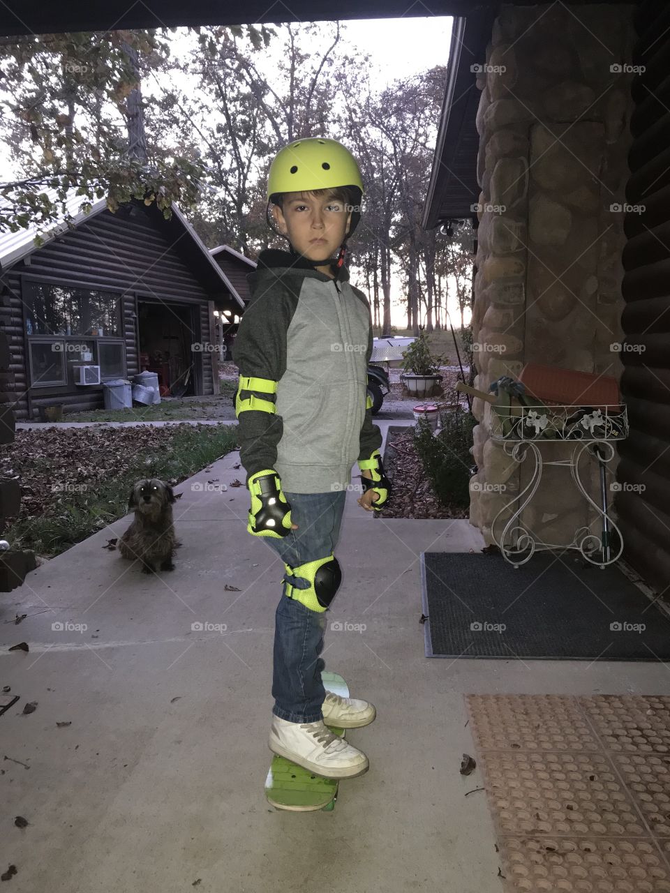 Little boy skateboarding in the country 