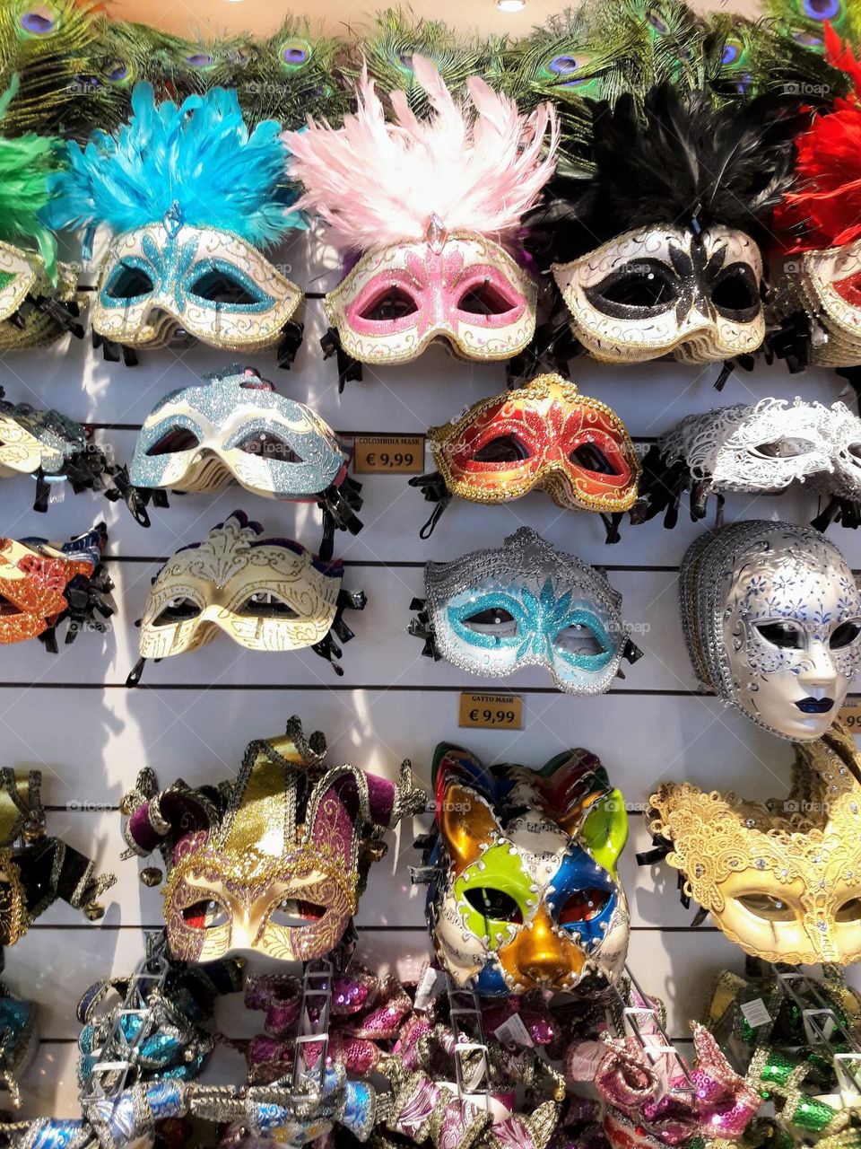 a shop selling a mixture of masks for the masquerade festival (venice)