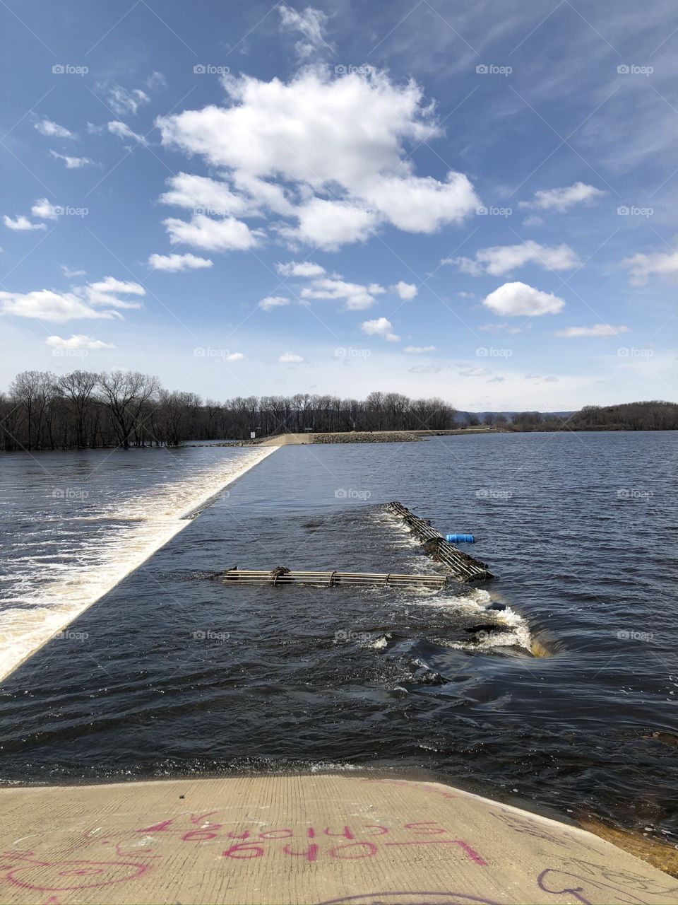 Spillway blue sky white clouds