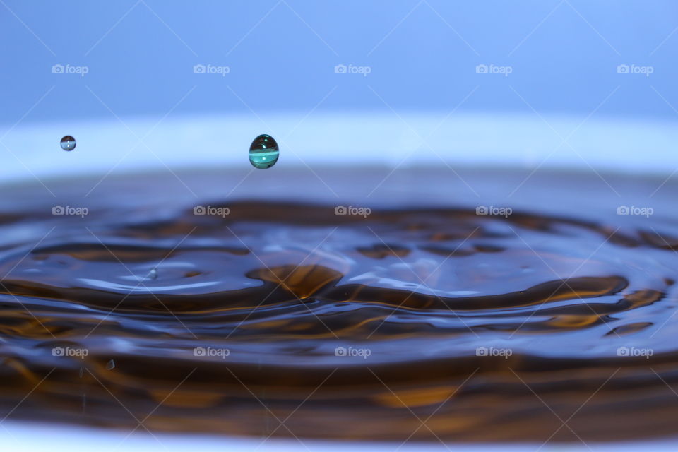 Drop falling in water