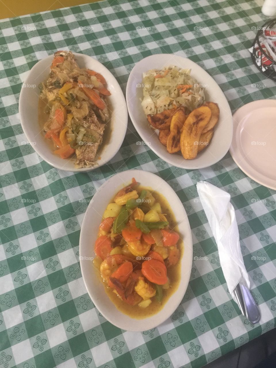 Dinner is served island style: Steamed Red Snapper, curried shrimp with Steamed cabbage and Fried Plantains.