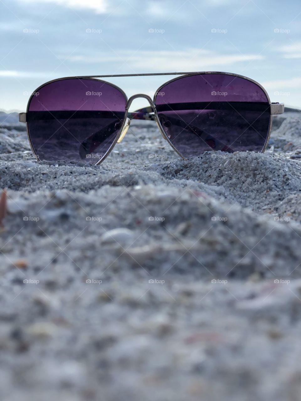 Sunglasses In Sand At The Beach