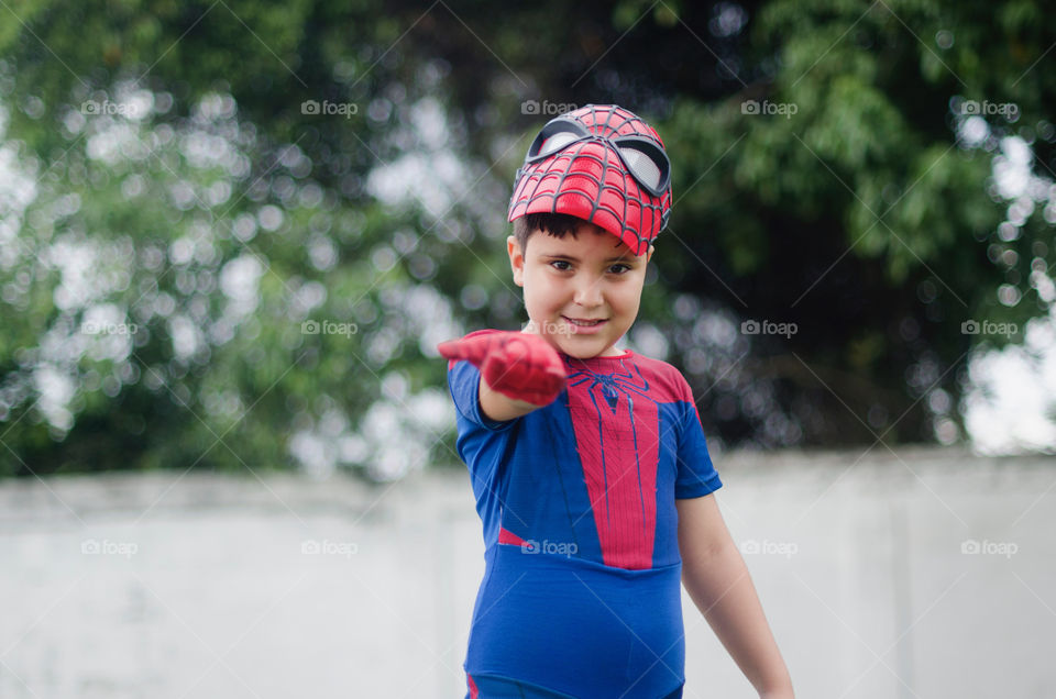 Child dressed up with a spiderman costume