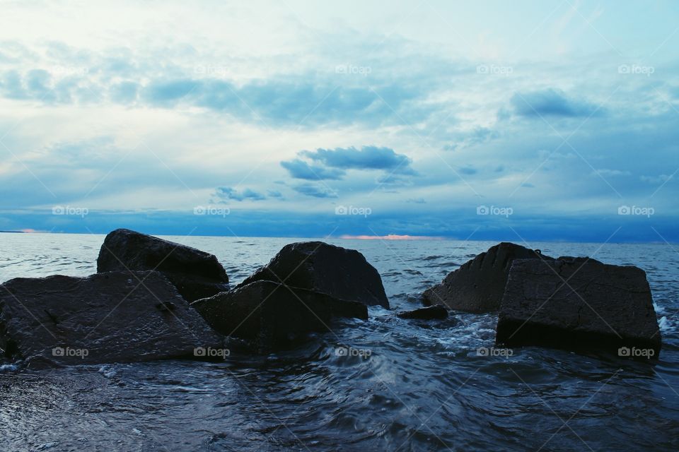 Stormy sea touching rocks
