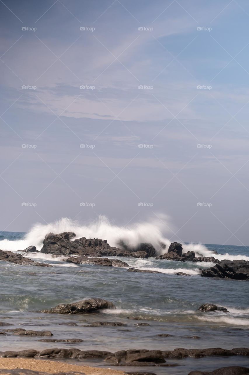 ripples of waves and rocks by the sea