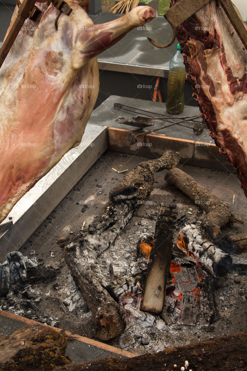 cooking lamb and meat at flame