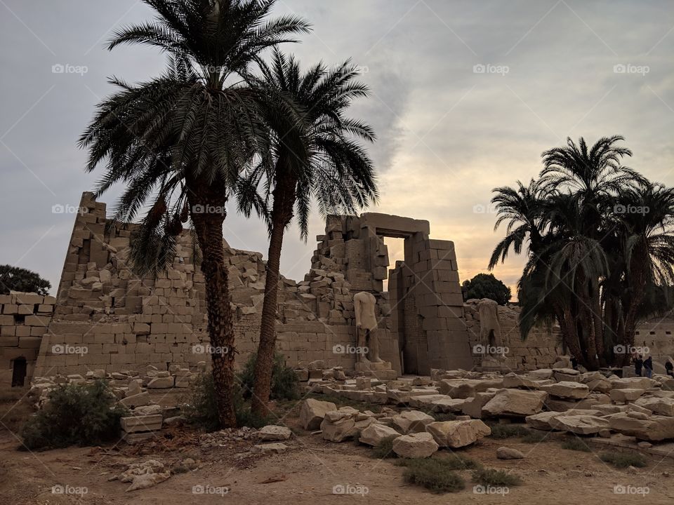 The sun setting behind the Temple of Karnak in Luxor, Egypt