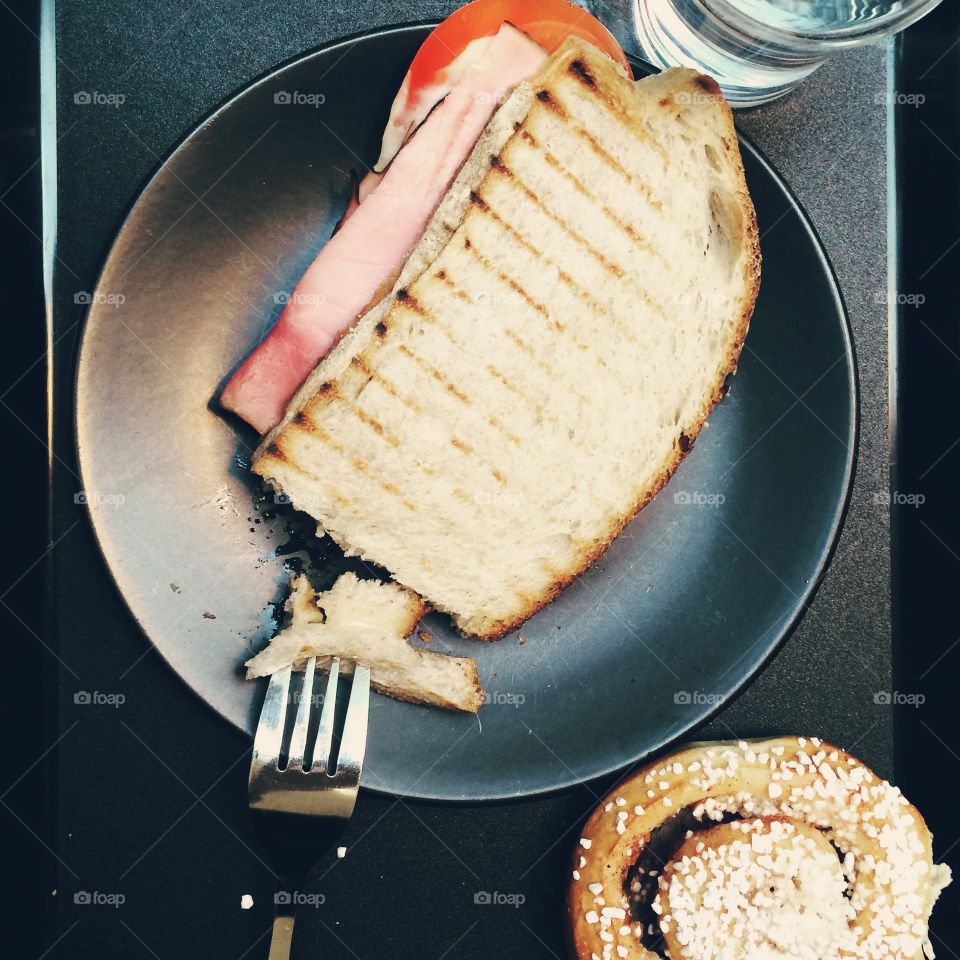 croque monsieur and cinnamon roll breakfast