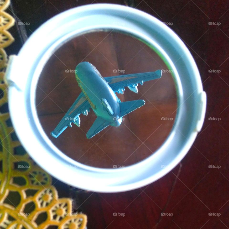 Blue plane in the mirror