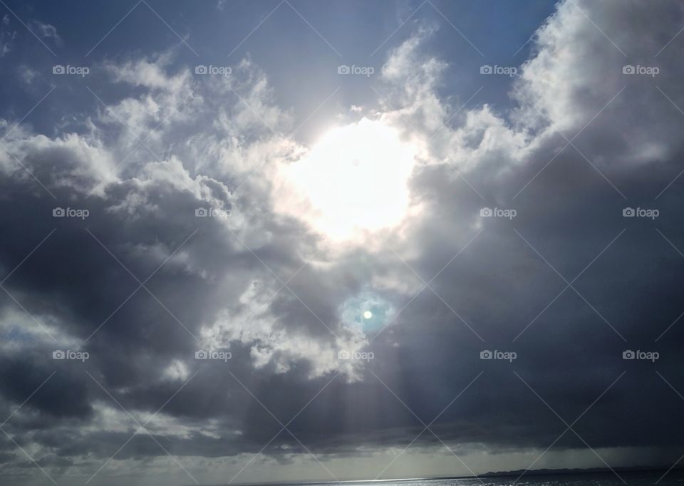 A sunny day where the sunshines on the sea