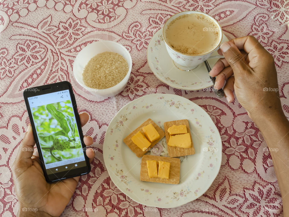 Coffee With Snack While Viewing Phone Content