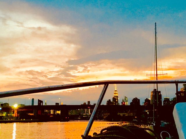 From our sailboat, the “Salvation” we took this picture of the sunset over Newtown Creek in Long Island City, Queens, NY. In the far distance you can see the Manhattan skyline and the Empire State Building. 2018. Hypnotic Productions