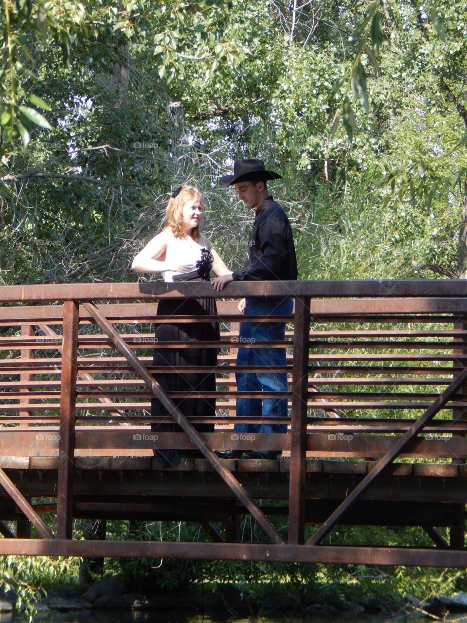 Couple meeting on a bridge