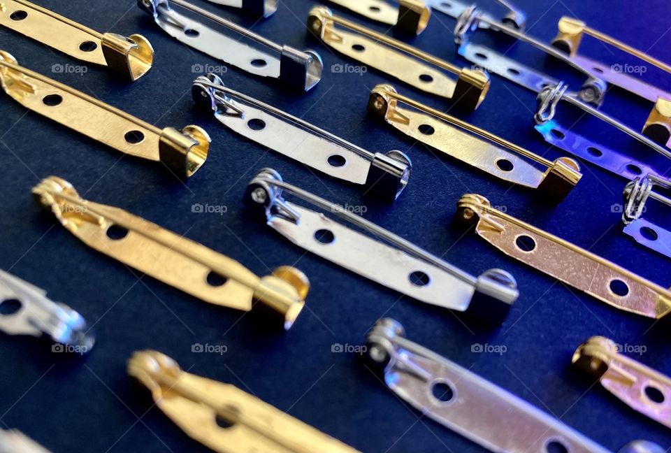 Gold and silver pins, fasteners for brooches