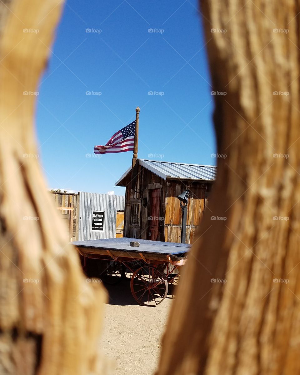 A unique perspective peeking through a hole in the gate