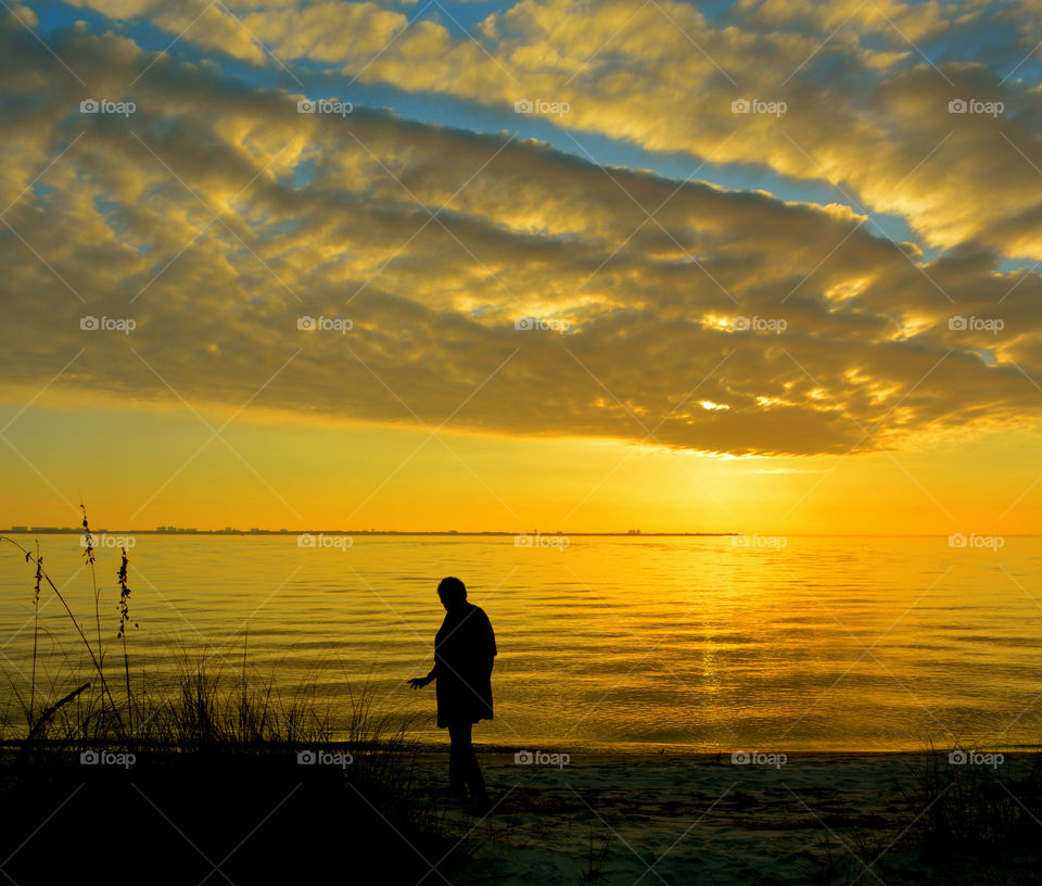Silhouette of man standing at beach