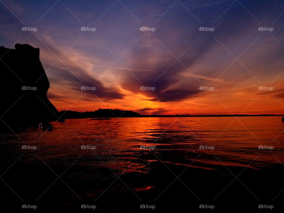 Thor watching an epic sunset on the lake!