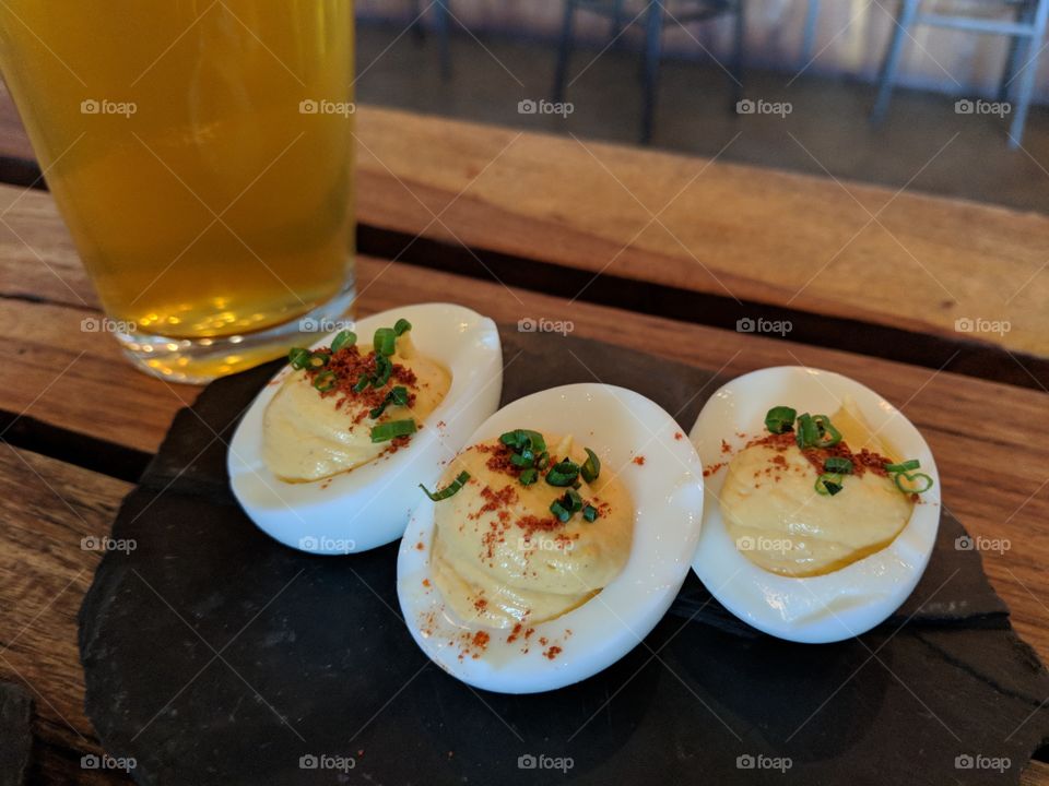 enjoying deviled eggs & a beer