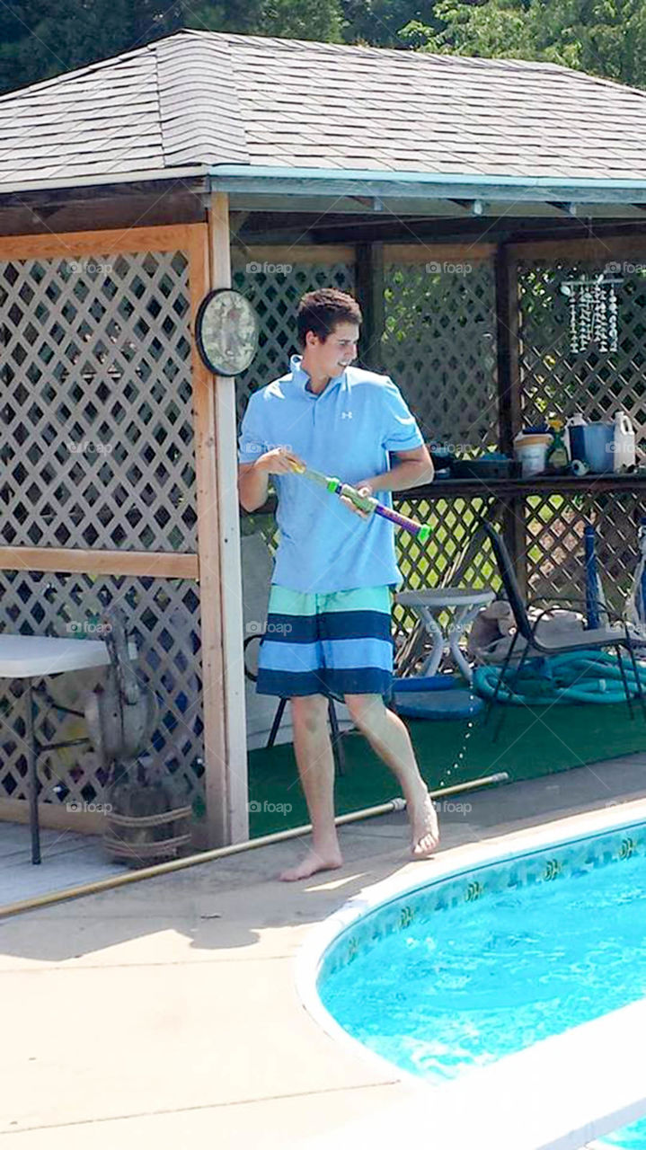 cabana boy. teenage boy at pool