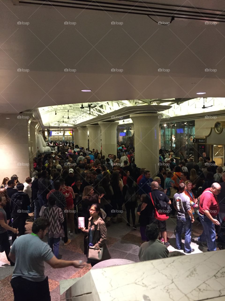 Train delays at a New Jersey transit station create a backlog of commuters in the lobby.