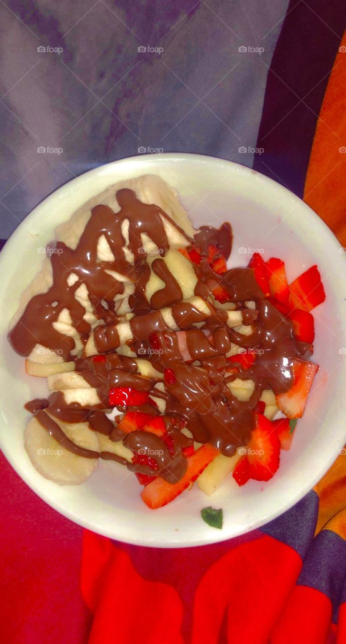 mmm banana and strawberries covered in low-fat chocolate syrup 
