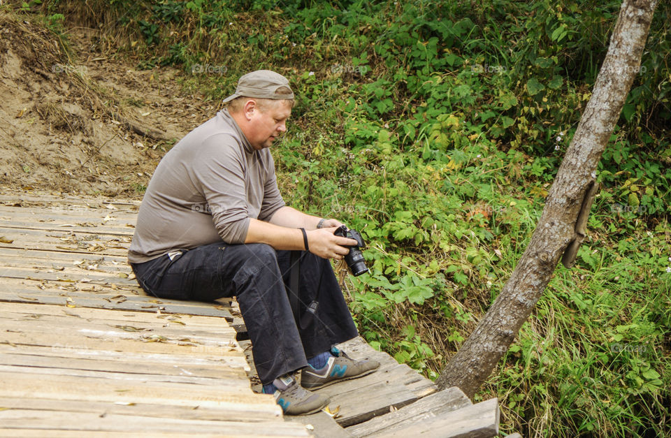 Male photographer taking pictures