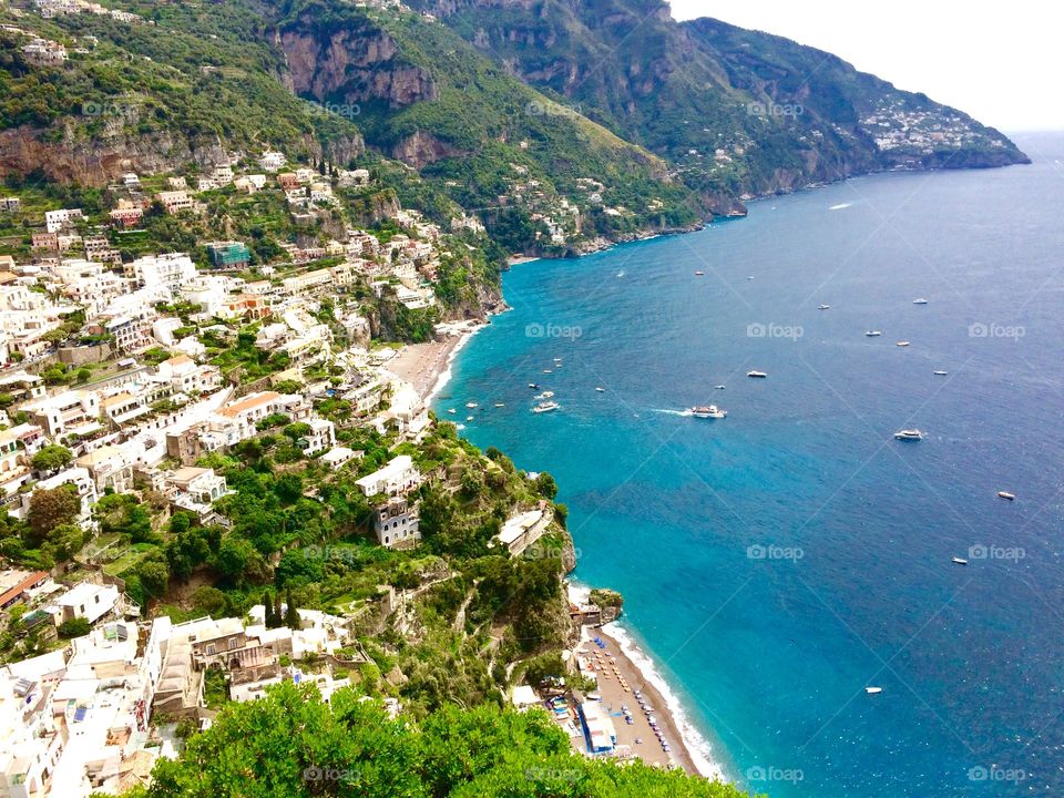 The green speckled coastline of Sorrento Italy overlooking the bright blue ocean