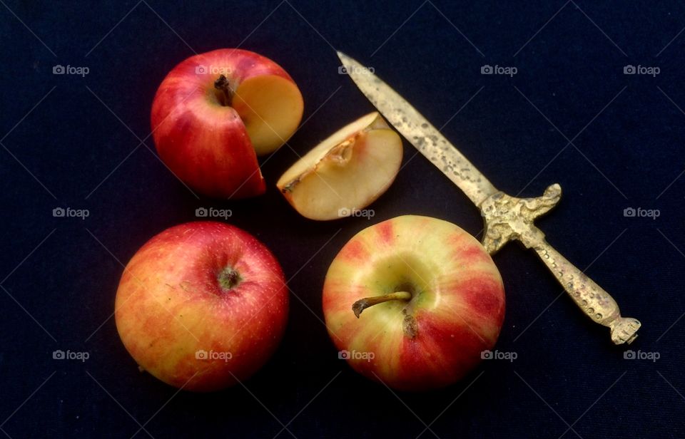 Apple with old brass knife